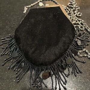 Small velvet evening bag from Simon’s. Beaded fringe, kiss clasp.